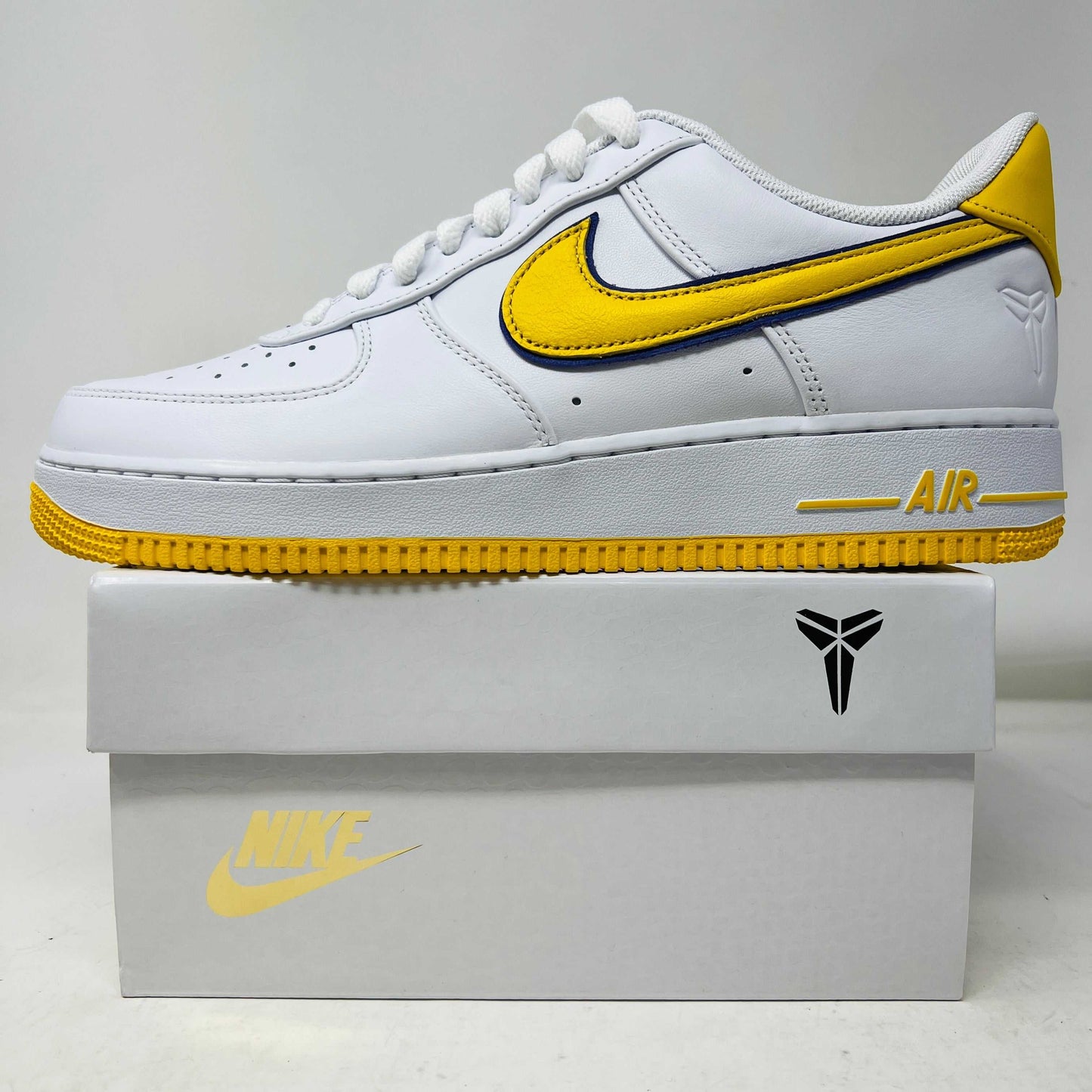 Nike Air Force 1 Low Retro QS Kobe Bryant Lakers Home sneakers, brand new condition, white with gold detailing, extra laces included, 2024 release.