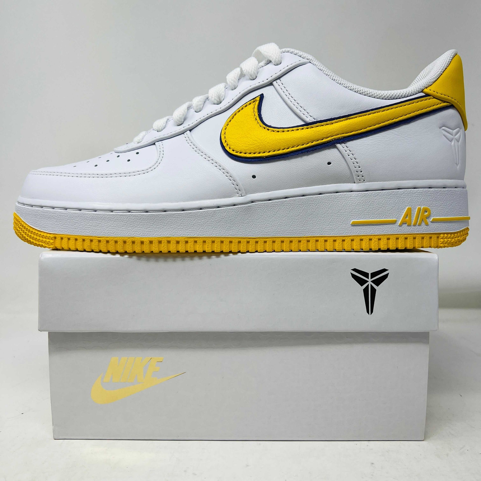 Nike Air Force 1 Low Retro QS Kobe Bryant Lakers Home sneakers, brand new condition, white with gold detailing, extra laces included, 2024 release.