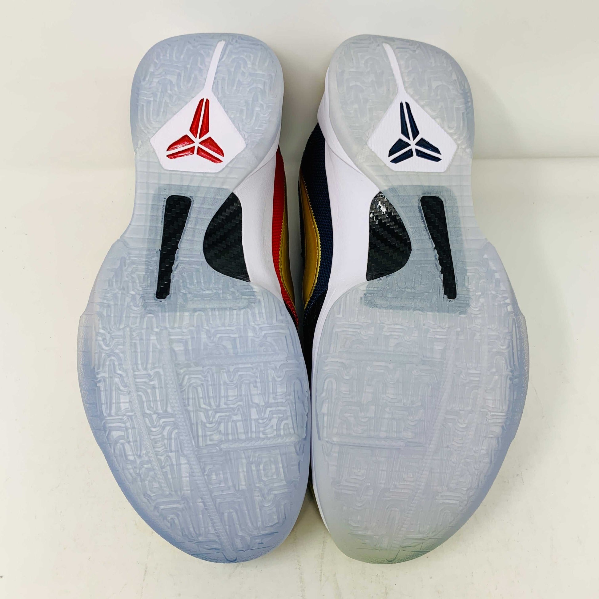 Kobe V Protro Undefeated Pack sneakers with dual colorway soles.