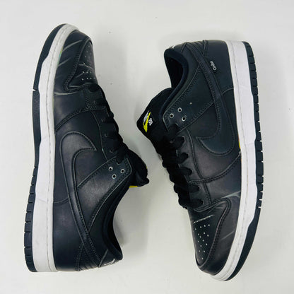Nike SB Dunk Low Civilist sneakers, black with white soles and yellow tongue details, showcased on a white backdrop. They blend style and comfort effortlessly, making them a standout in 2020 sneaker collections.