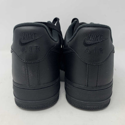 The Nike Supreme Air Force 1 Black features a perforated design on the toe box, black supreme laces with a shiny tag, and a prominent Nike logo, all set against a plain white background.