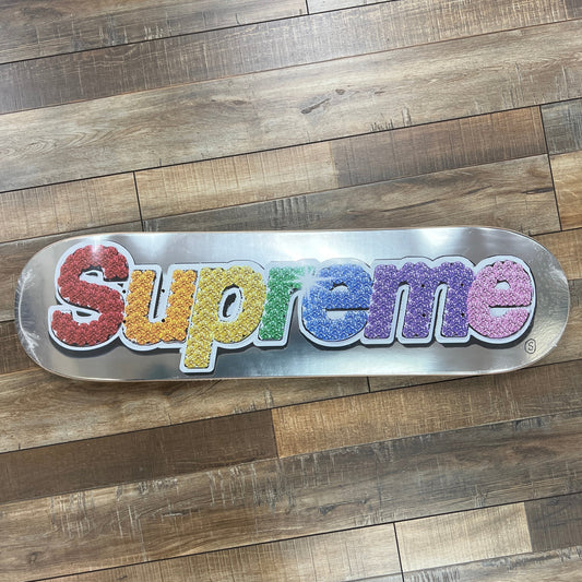Supreme Bling Box Logo skateboard deck platinum with multicolor sparkle lettering on silver background