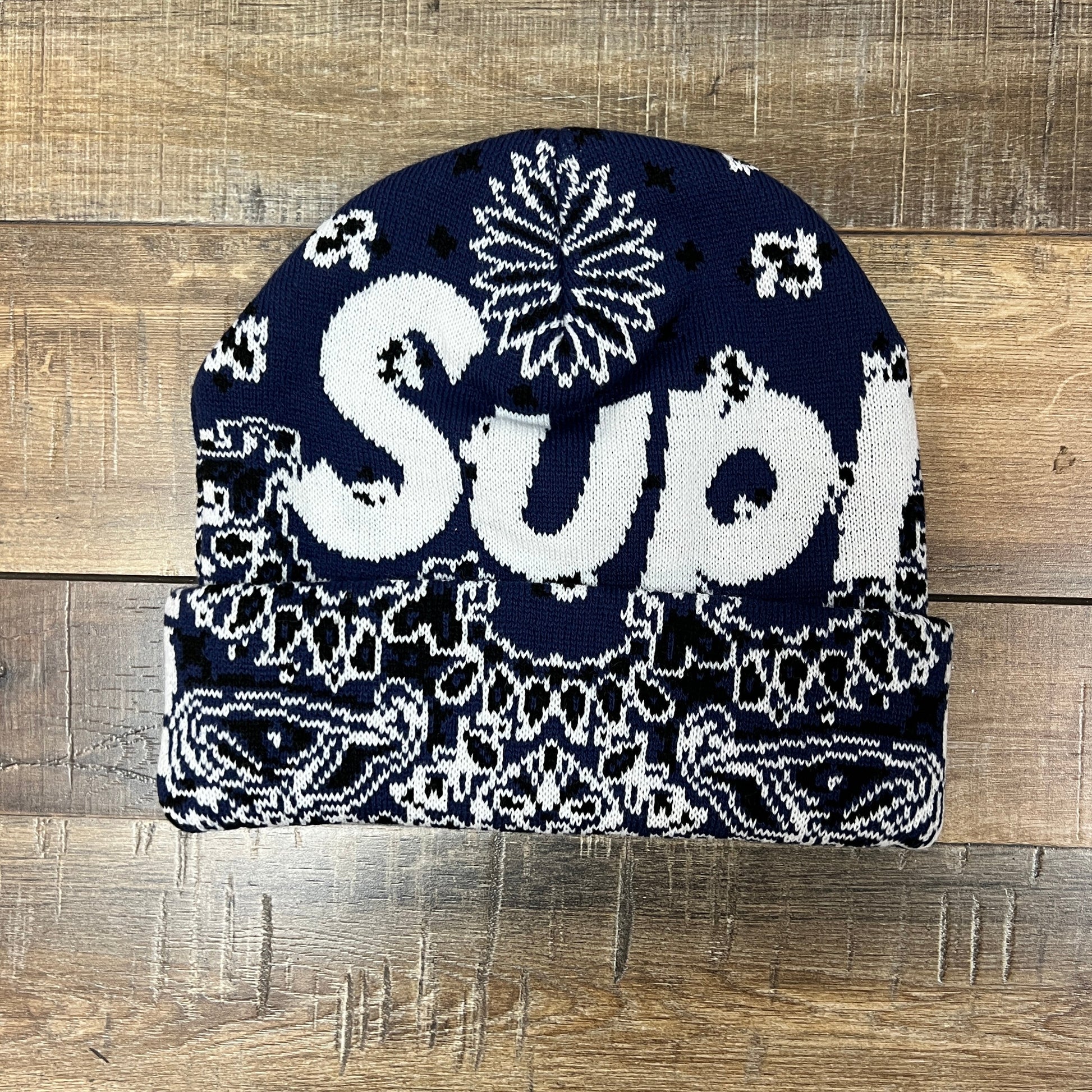 Blue Supreme Big Logo Bandana Beanie on wooden background