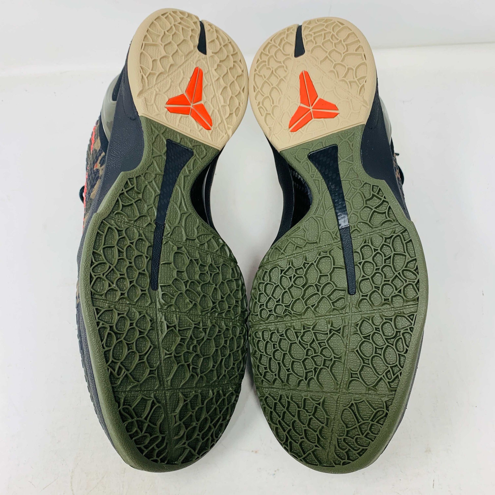 The 2024 Nike Kobe 6 Protro Italian Camo features a textured gray upper with a bright red swoosh, sits on a black shoe box, and has a greenish midsole labeled Zoom. The sleek black lace system completes this authentic sporty sneaker.