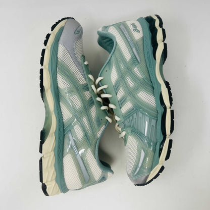 The ASICS Gel-Kayano 12.1 Kith Cream Sage sneakers in pastel green and white feature a breathable mesh design. Theyre accompanied by two packs of extra laces (green and white with black speckles), offering versatile styling for your 100% authentic needs.