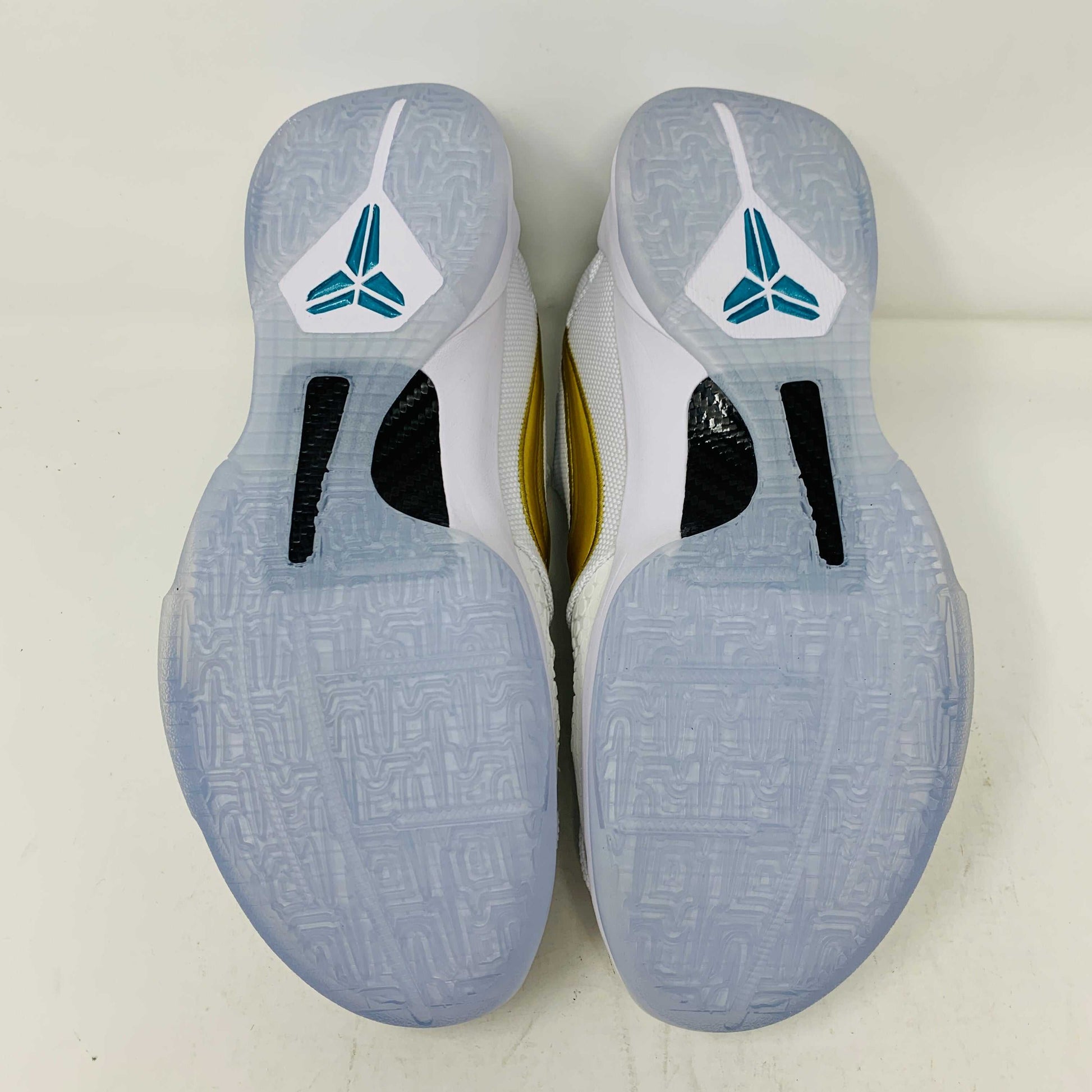 Kobe V Protro Undefeated Pack sneaker bottoms with icy sole and branding.