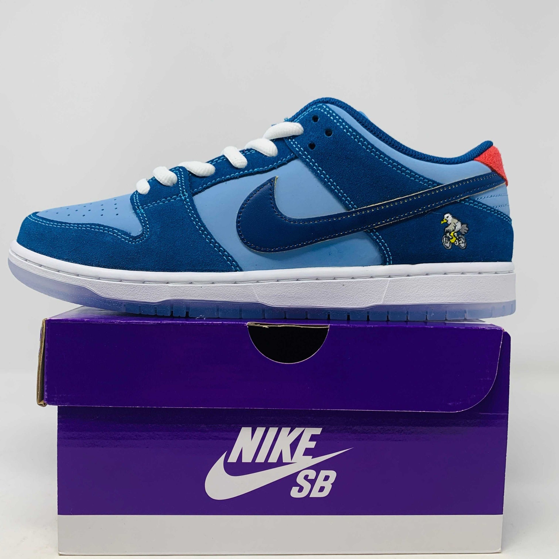 Nike SB Dunk Low "Why So Sad?" sneakers 2022, blue with extra laces.