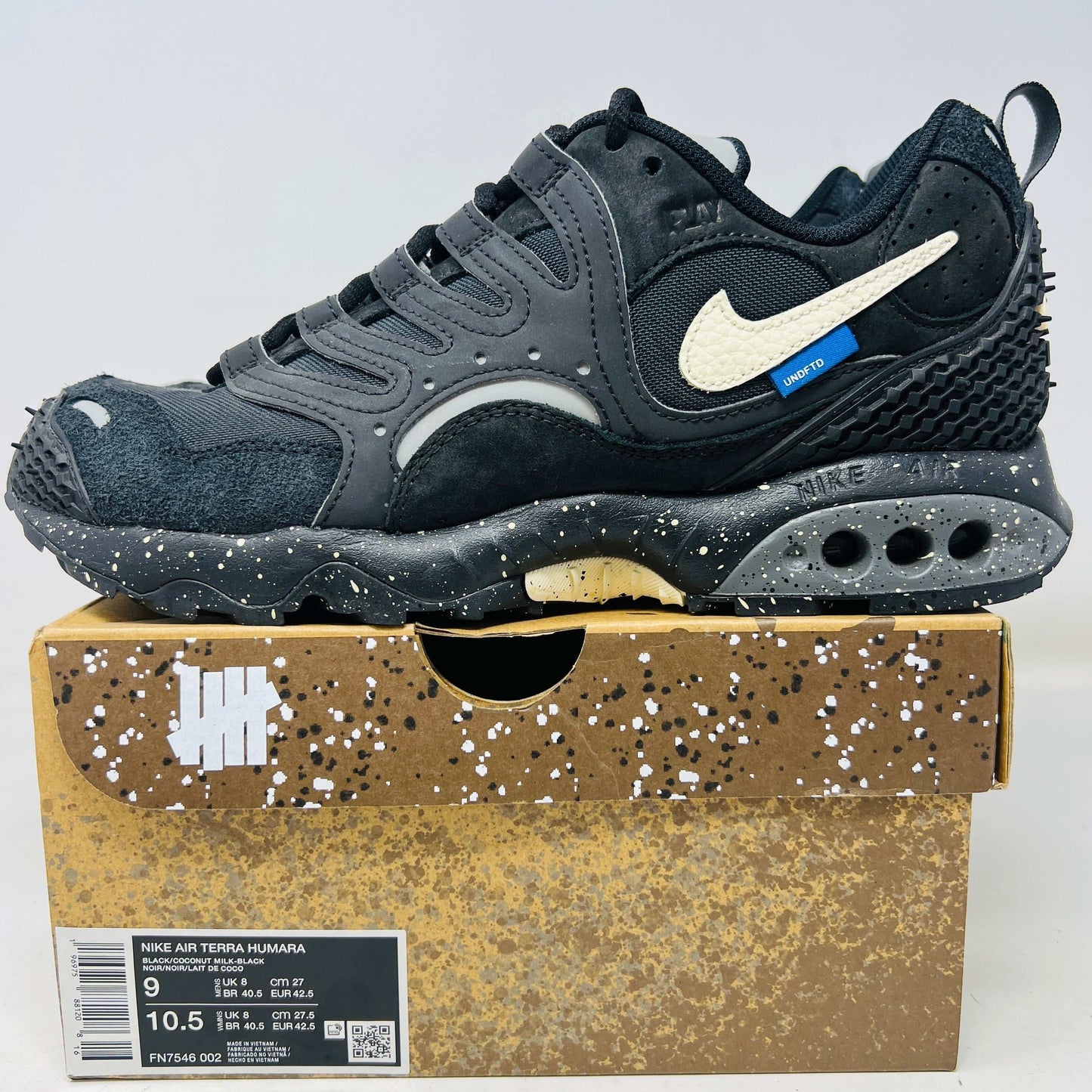 Nike Air Terra Humara Undefeated Black sneaker on branded box with speckled sole and white swoosh logo