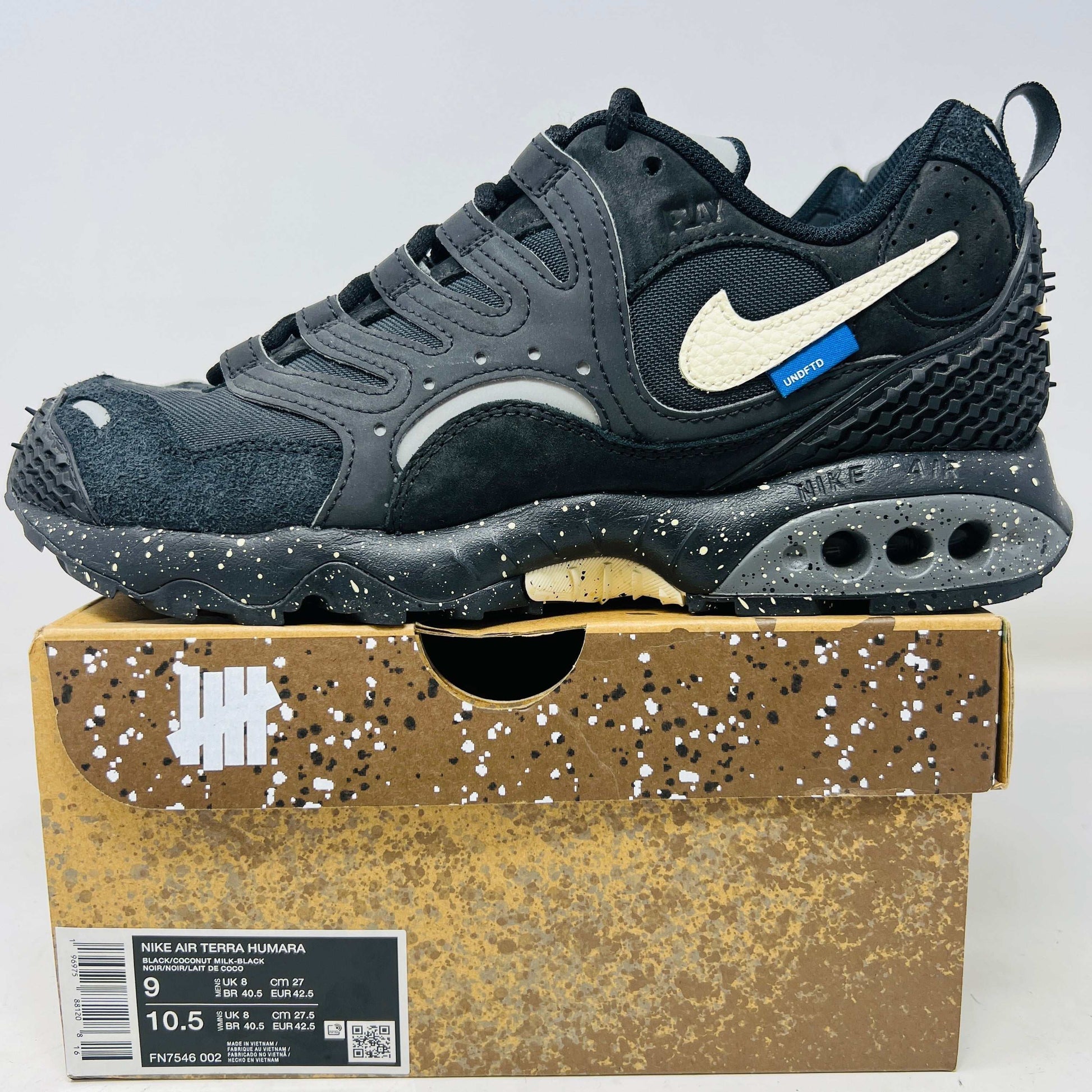 Nike Air Terra Humara Undefeated Black sneaker on branded box with speckled sole and white swoosh logo