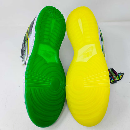 The Nike Dunk Low What the Duck Away University of Oregon PE is a vibrant sneaker featuring green, white, and black patterns with a black Nike swoosh outlined in yellow. It includes white laces, extra laces, a speckled white midsole, and a padded yellow lining atop a bright green shoebox. 100% authentic.