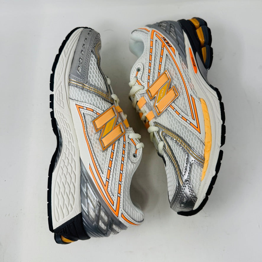 New Balance 1906R ASOS Exclusive Neon Pack in orange on display box.