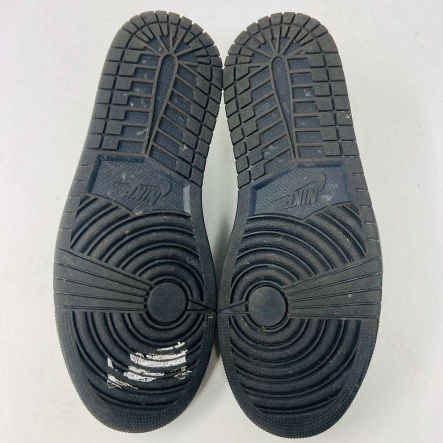 A pair of Jordan 1 Retro Low OG SP Travis Scott Black Phantom sneakers with perforated toe boxes and black and white checkered laces includes extra laces for added style. These authentic Jordans are displayed side by side on a white surface.