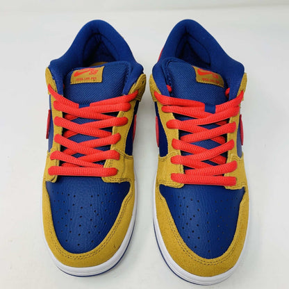 The Nike SB Dunk Low Reverse Papa Bear features a blue and yellow suede upper, a red Swoosh, and orange laces. It comes with extra yellow laces in front of its purple Nike SB box and is 100% authentic.