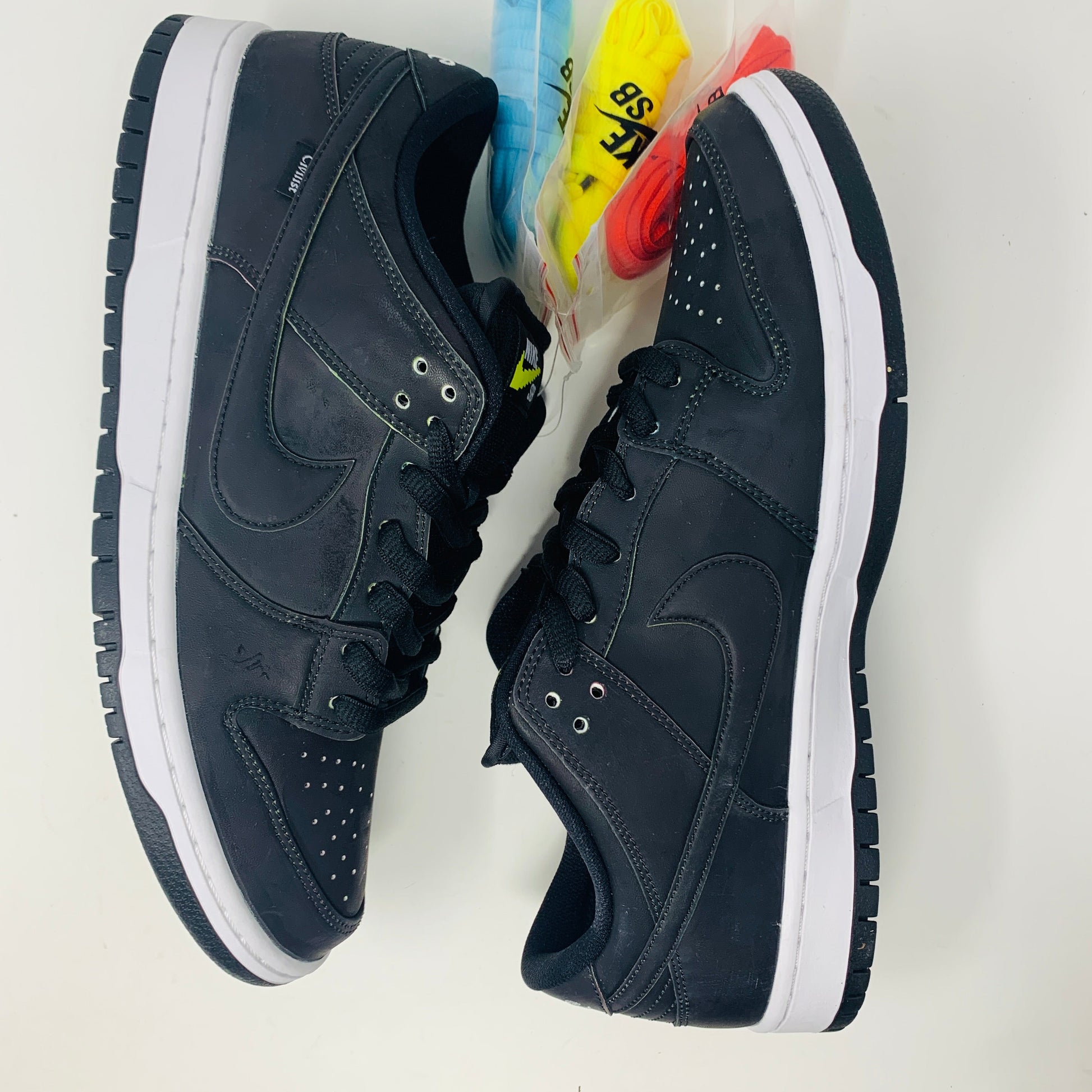 Nike SB Dunk Low Civilist sneakers, brand new condition, with extra red, yellow, and blue laces, 2020 release.