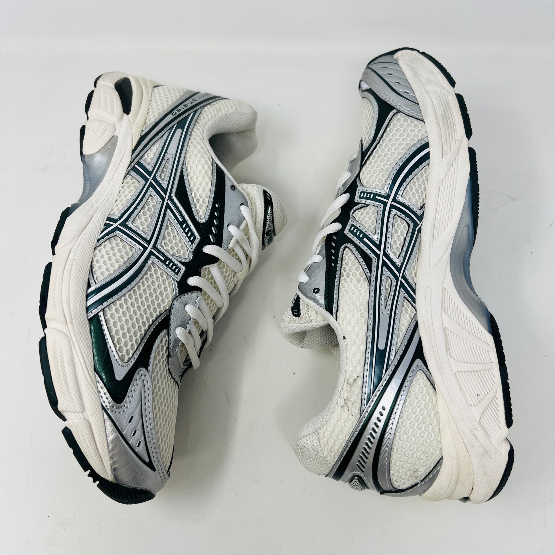 An ASICS GT-2160 Kith Cream Scarab (2023) running shoe with a clean cream and scarab-colored mesh design featuring black accents sits on a brown box. Priced at $350, the box in good condition details sizing and brand logos.