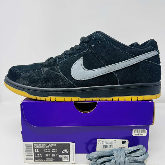 Nike SB Dunk Low Fog sneakers, size 11, 2021 release, worn condition with extra laces, displayed on box.