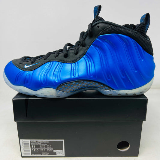 Nike Air Foamposite One International Blue sneaker with clean uppers and light wear on black shoe box