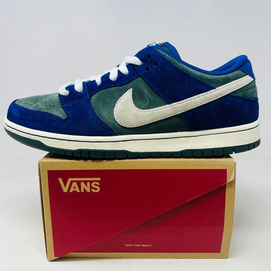 Nike SB Dunk Low Deep Royal Blue sneakers, 2024 edition, slight wear, 8.5/10 condition, displayed on a Vans box.