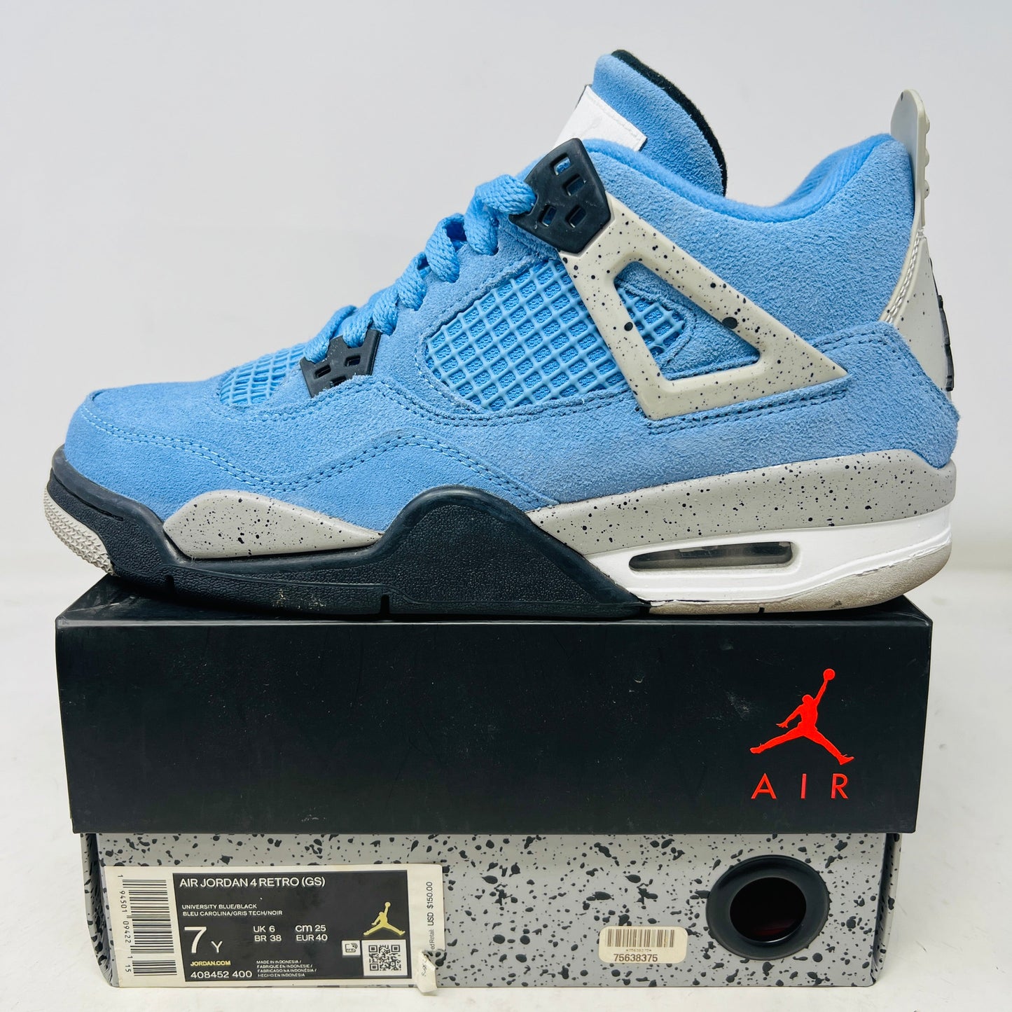 Jordan 4 Retro University Blue GS sneaker in light blue with clean uppers on original box