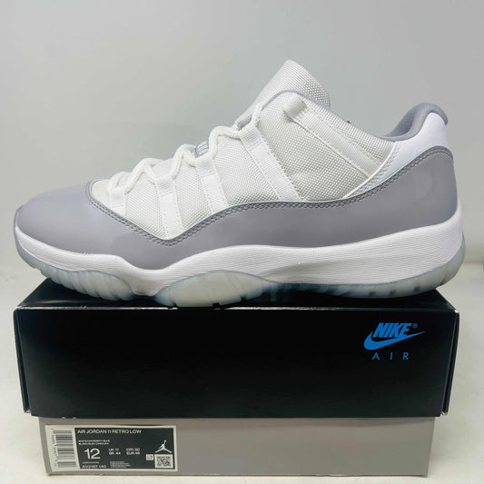 Jordan 11 Retro Low Cement Grey sneaker in white and grey on Nike Air box, size 12, 2023 model