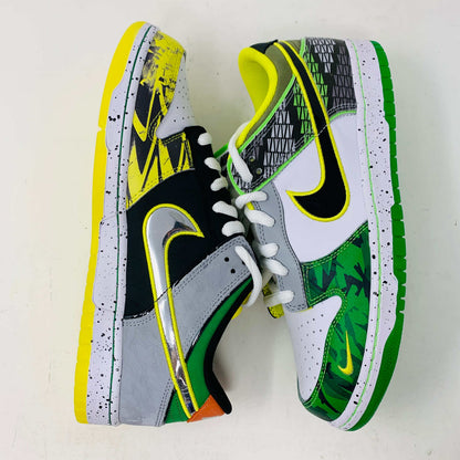 The Nike Dunk Low What the Duck Away University of Oregon PE is a vibrant sneaker featuring green, white, and black patterns with a black Nike swoosh outlined in yellow. It includes white laces, extra laces, a speckled white midsole, and a padded yellow lining atop a bright green shoebox. 100% authentic.