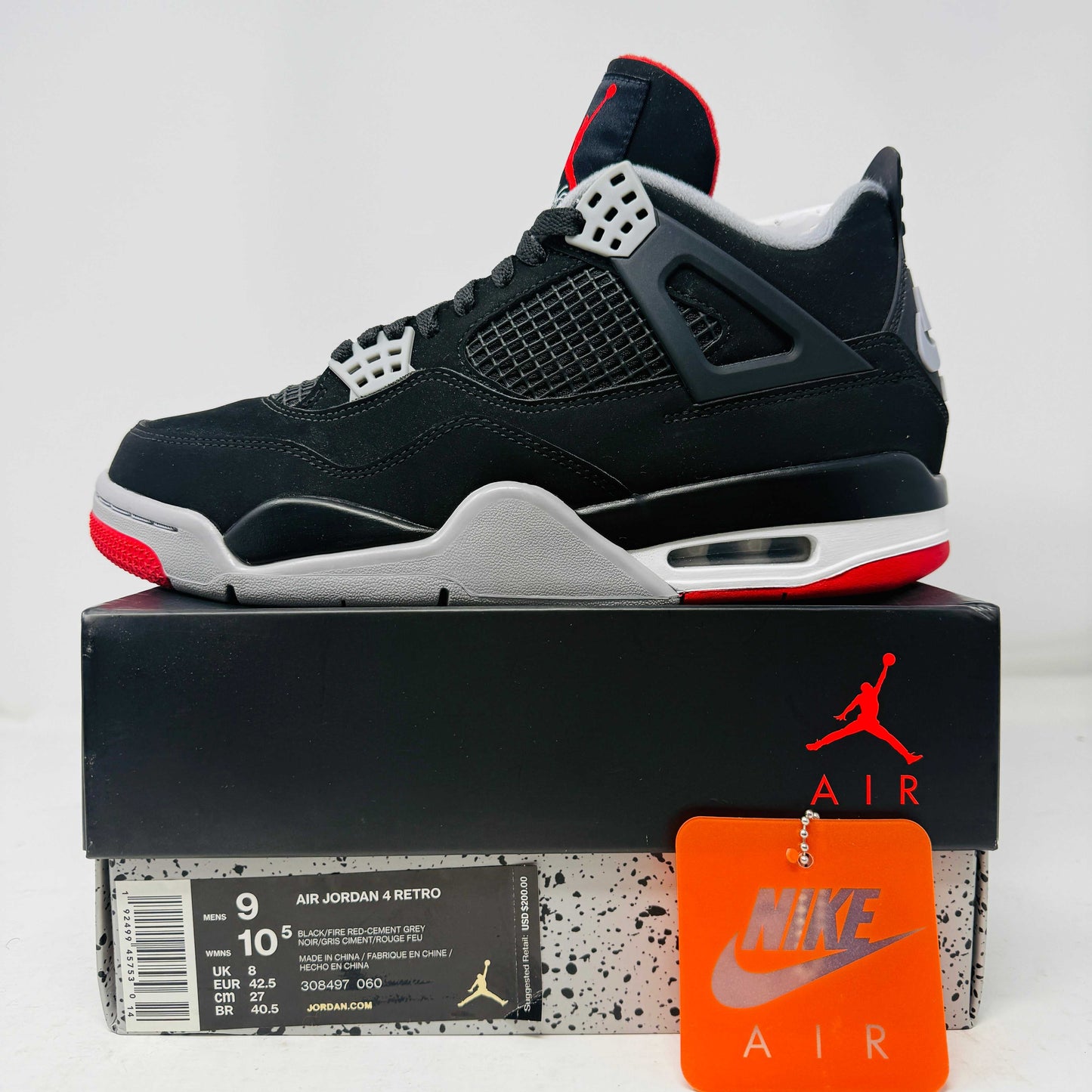 Jordan 4 Retro Bred 2019 sneaker on box with clean uppers and hang tag in size 9 US