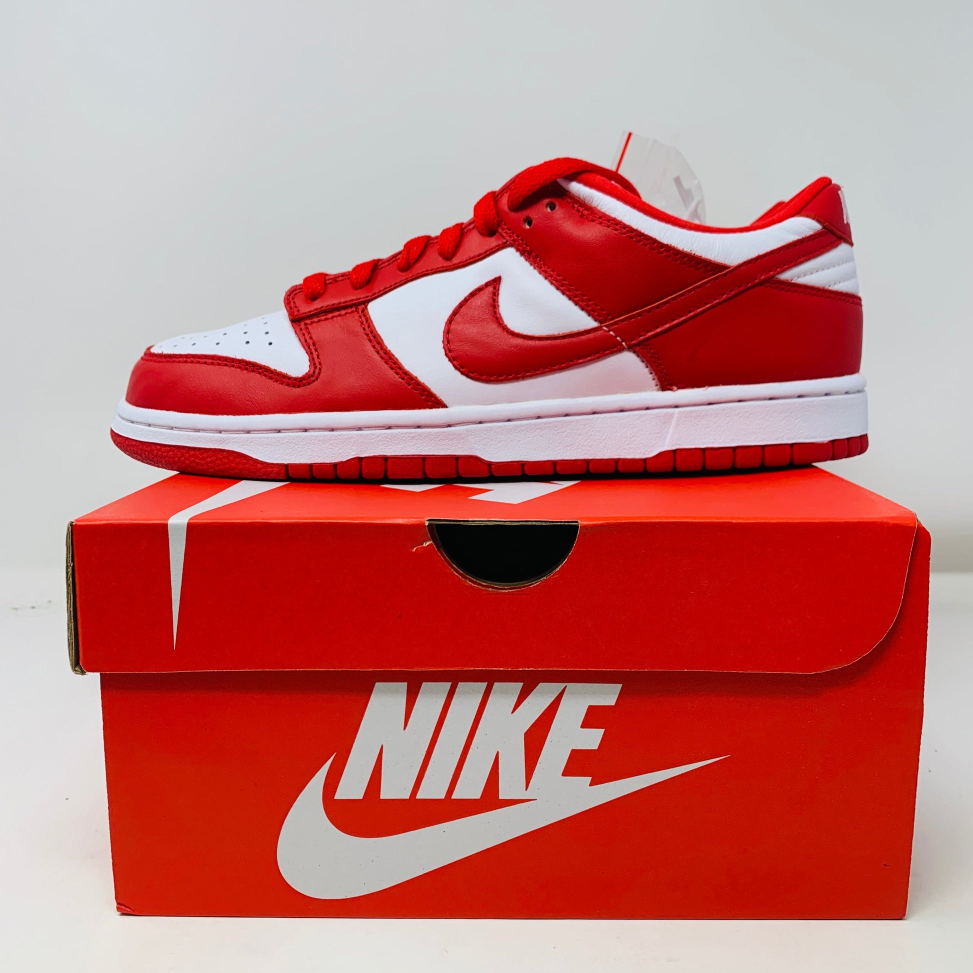 Nike Dunk Low SP St. John's 2023 sneaker in red and white on original box.