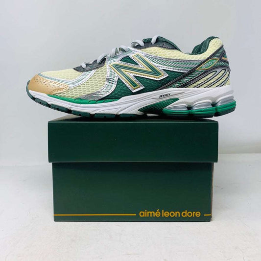 New Balance 860v2 Aime Leon Dore Green sneakers on box, featuring sail and green laces, 2023 release.