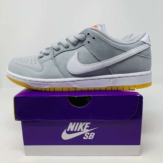 Nike SB Dunk Low Wolf Grey Gum sneaker on box, 2023 release.