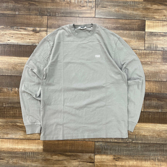 Kith Long-Sleeve LAX Tee Court in gray laid flat on wooden floor preowned