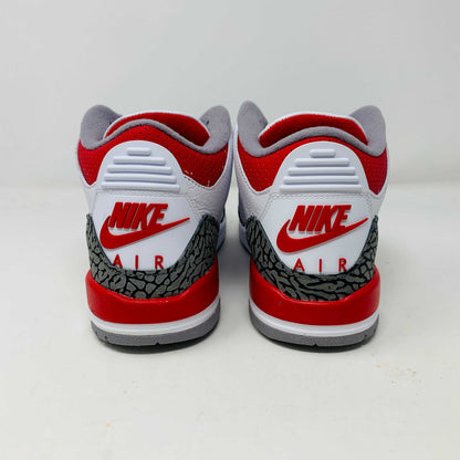 The Jordan 3 Retro Fire Red (2022) (GS) features white, red, and gray colors with elephant-print accents on a black-and-gray patterned box. The box has a red jumping silhouette and bold AIR lettering, making this BRAND NEW release ideal for collectors and enthusiasts.