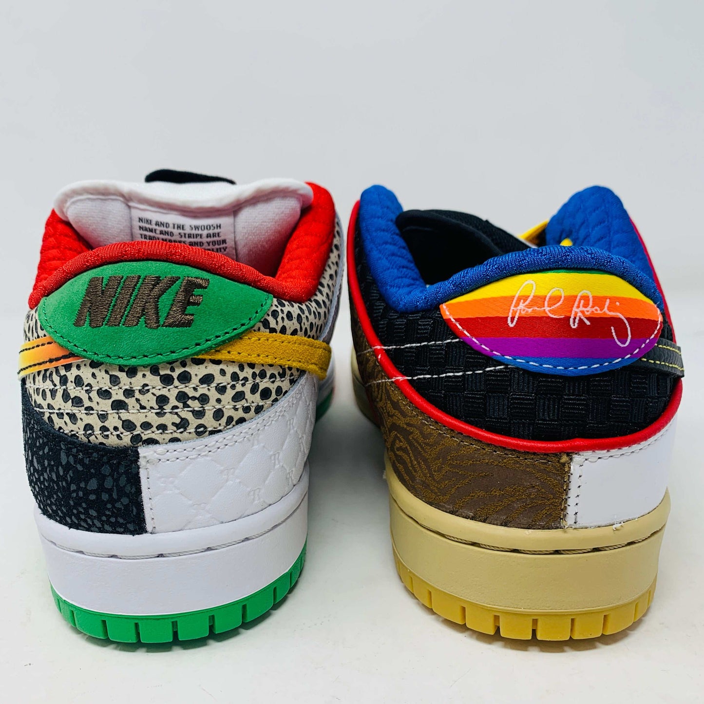 The Nike SB Dunk Low What the Paul is a 2021 authentic sneaker featuring varied textures and patterns like elephant print, a gradient swoosh, red laces, and comes in a colorful green, yellow, and white Nike SB box.