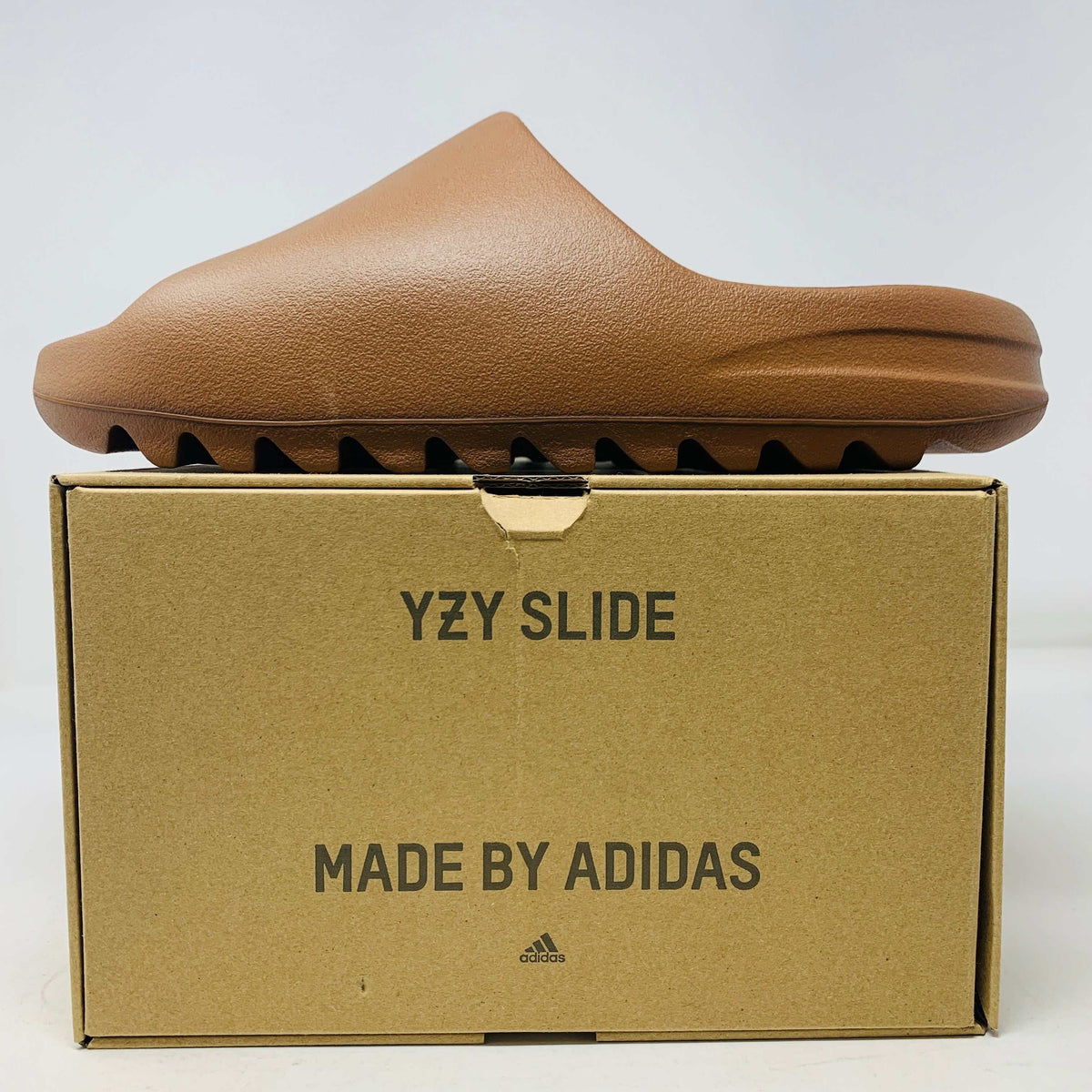 Yeezy Slide Flax 2022 in brand new condition, displayed on original box.