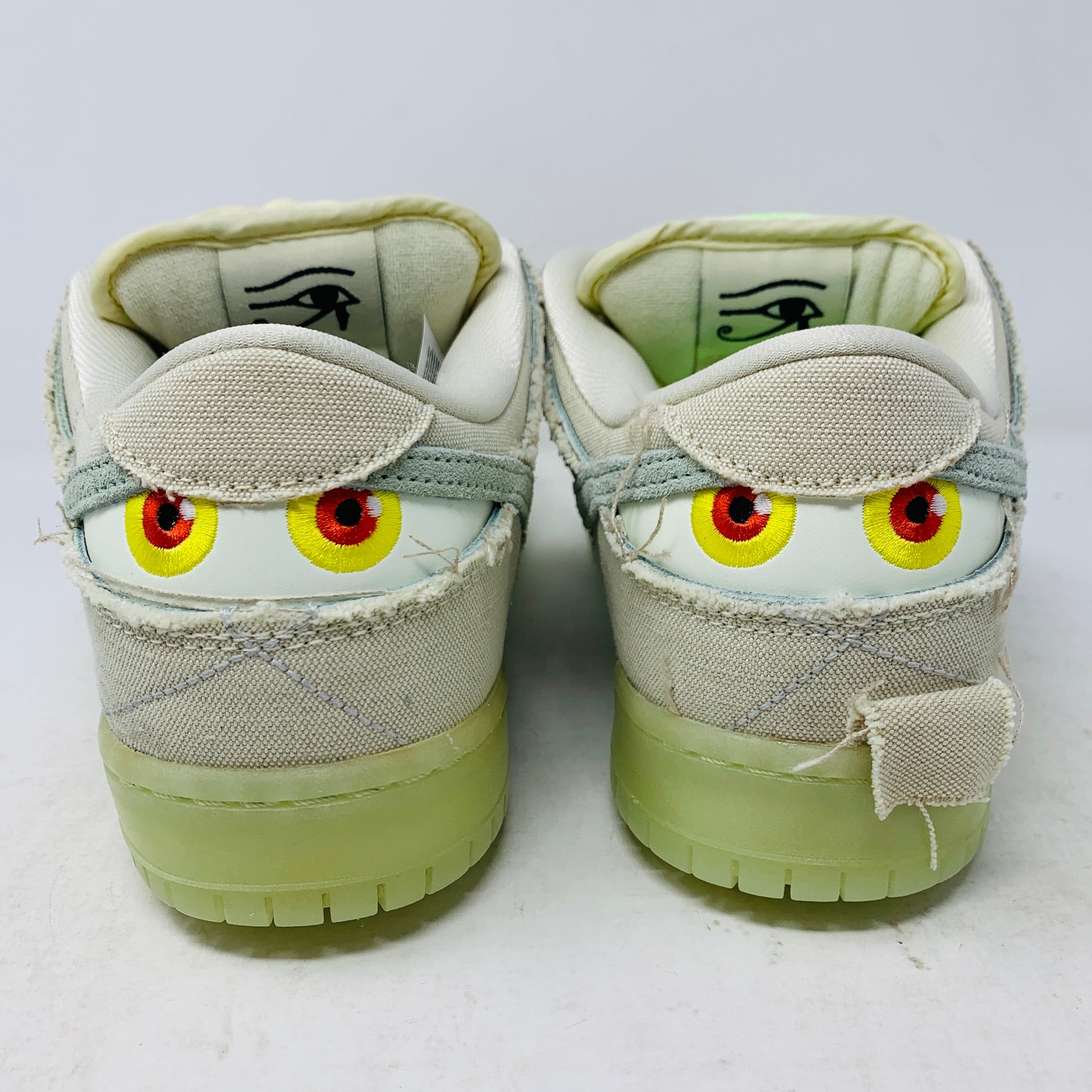 Nike SB Dunk Low Mummy sneakers with extra green laces, brand new, back view showing eye details, 2021 model.