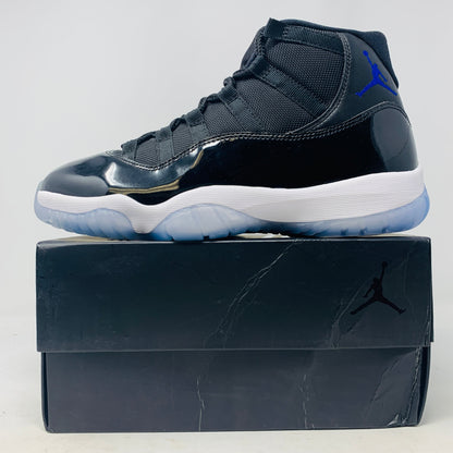 Jordan 11 Space Jam sneaker with black patent leather and blue Jumpman logo on black box