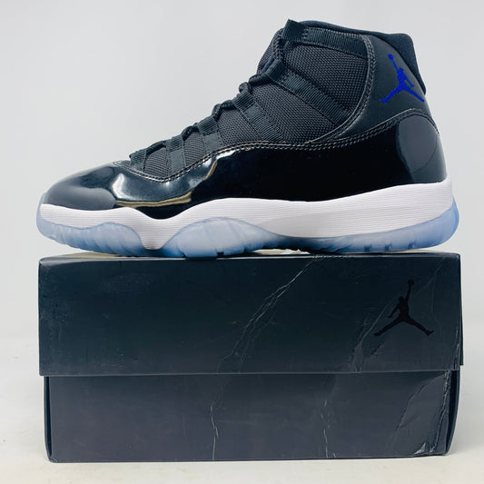 Jordan 11 Space Jam sneaker with black patent leather and blue Jumpman logo on black box