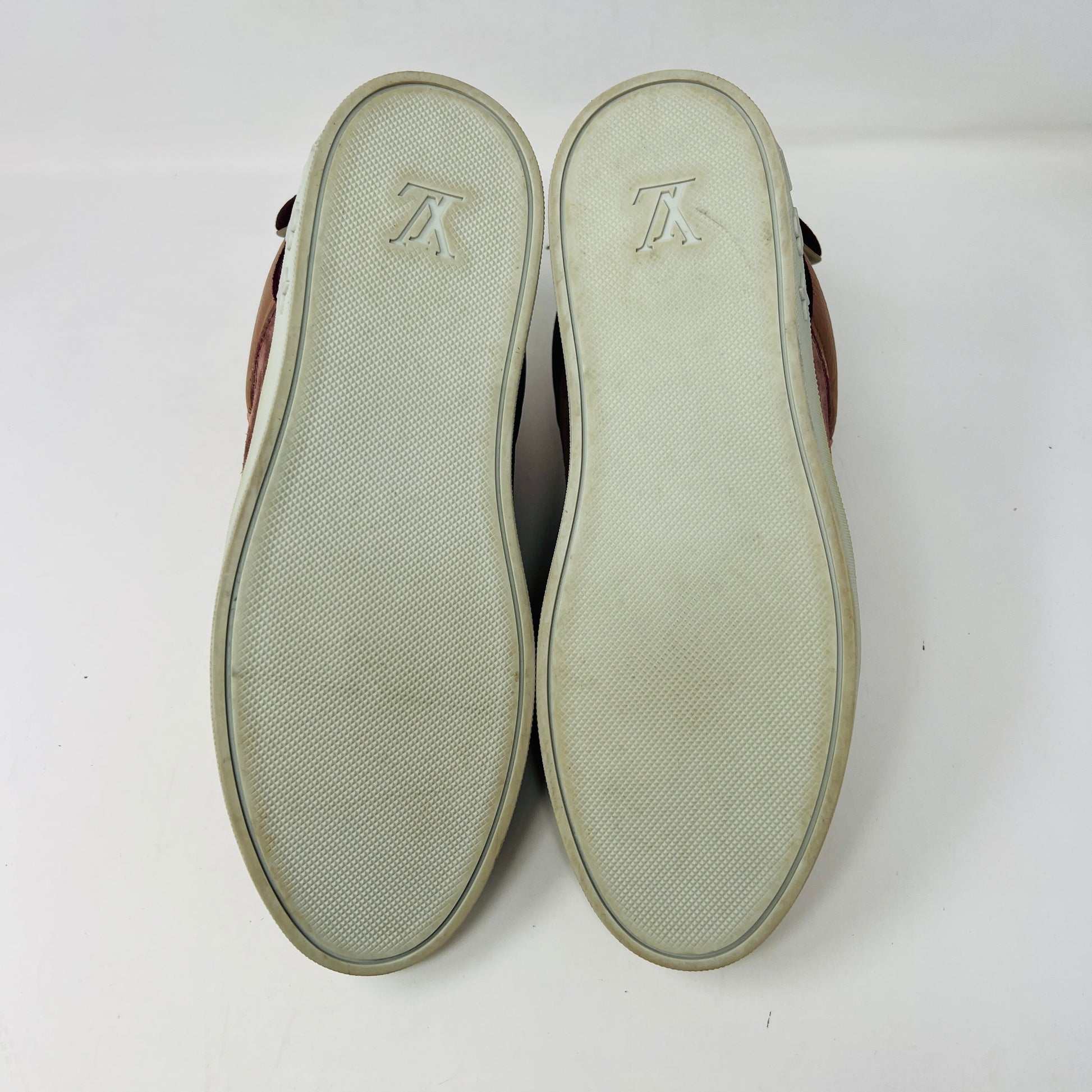 The Louis Vuitton Don Kanye Patchwork high-tops showcase brown and pink leather details with dark brown laces and a logo on the tongue. The white soles have a pink touch at the collar, ideal for size 7 fashionistas seeking extra flair.
