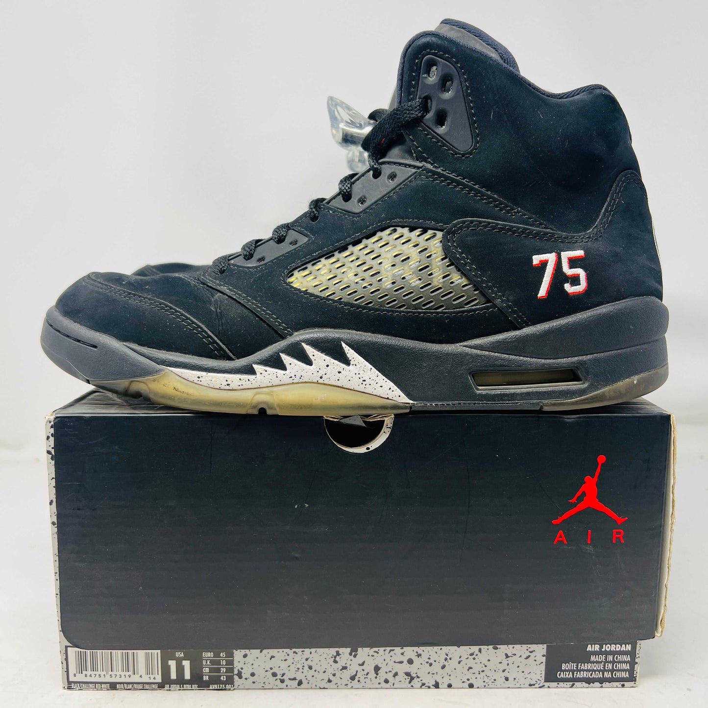 Used Jordan 5 Retro Paris Saint-Germain black sneaker with lace locks on box with red Air Jordan logo