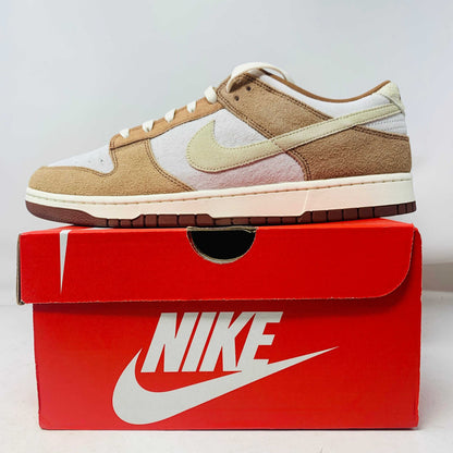 Nike Dunk Low Medium Curry sneakers, brand new, displayed on a red Nike box.