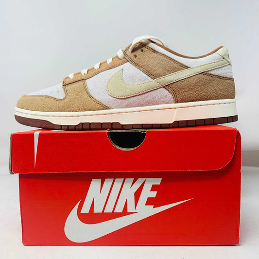 Nike Dunk Low Medium Curry sneakers, brand new, displayed on a red Nike box.