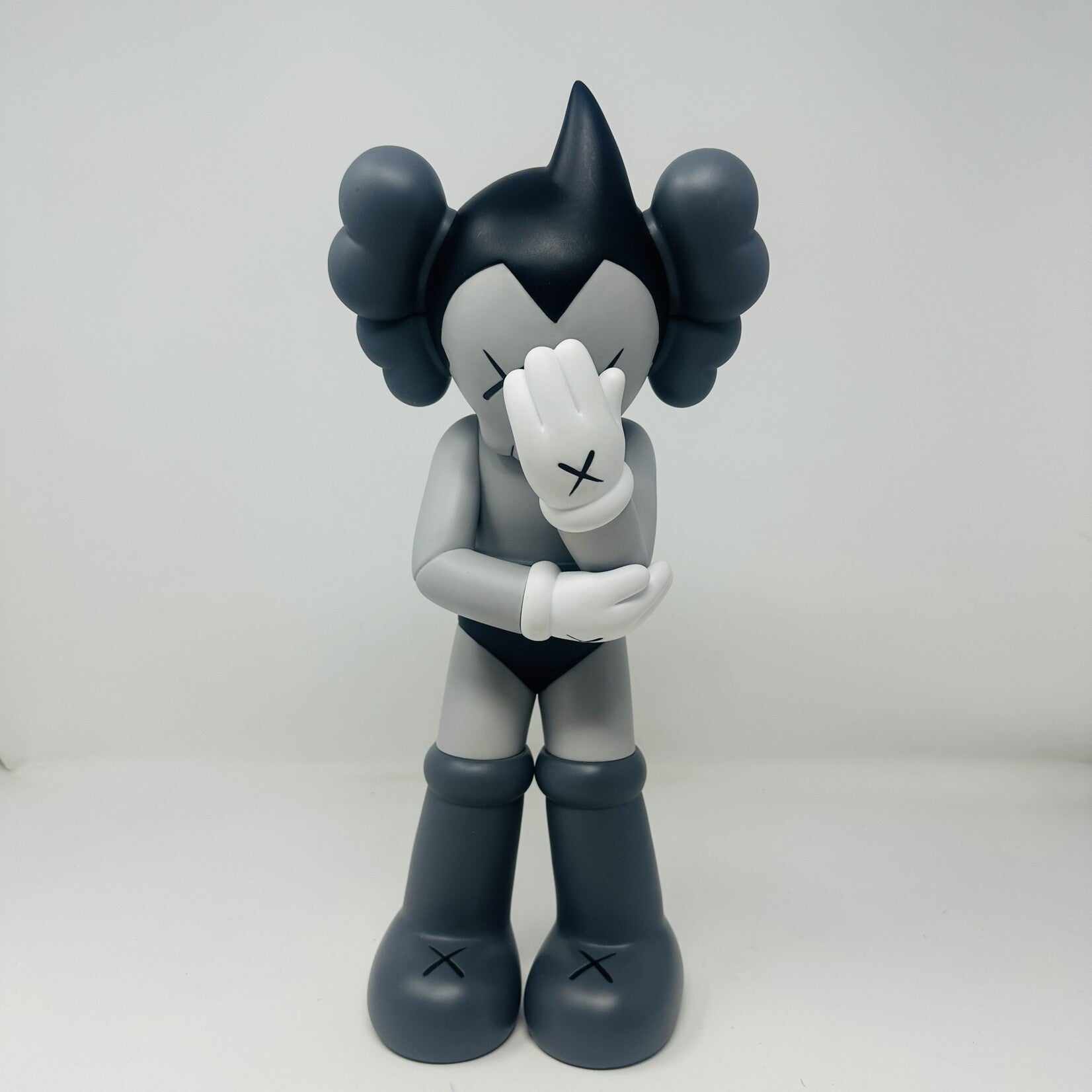 KAWS Astro Boy Vinyl Figure Grey in good condition.