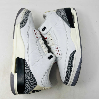 Jordan 3 Retro White Cement Reimagined sneaker on Nike box, 2023 release.