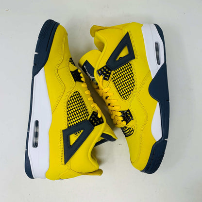 Jordan 4 Lightning sneakers in bold yellow and black with premium materials and lightning bolt accents.