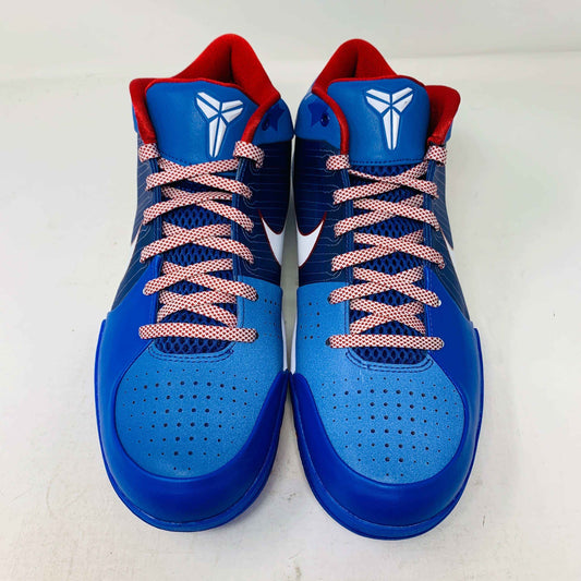 The Nike Kobe 4 Protro Philly (2024) basketball shoes are blue with red interiors and laces, featuring a white Nike logo on the tongue. They include perforated detailing on the toe area and a white swoosh on the sides, all set against a white background.