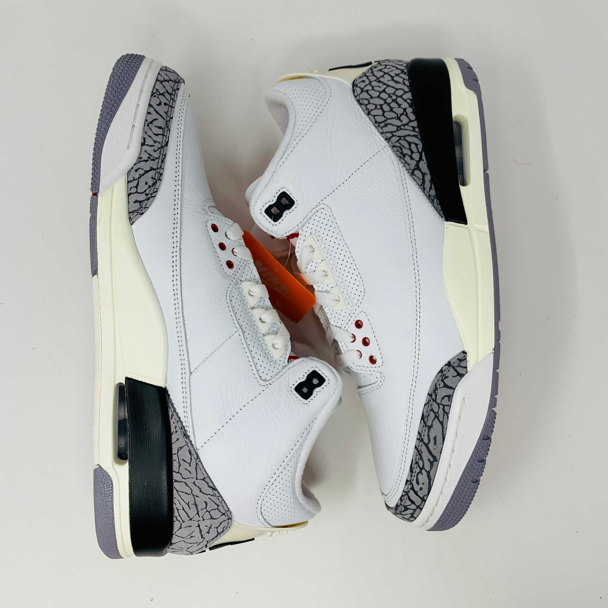 Jordan 3 Retro White Cement Reimagined sneakers, modern design, iconic white and cement colorway.