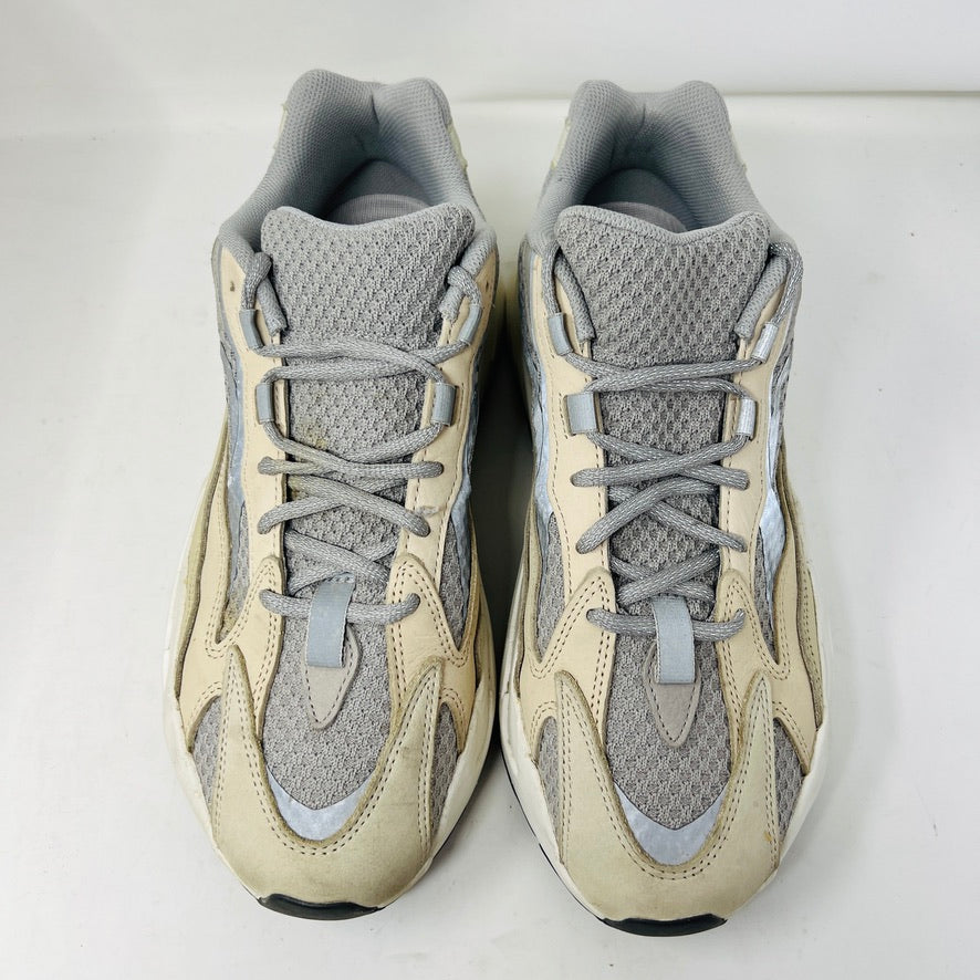 Adidas Yeezy Boost 700 V2 Cream sneakers in beige, gray, and white rest on a brown box labeled Yeezy Boost 700, Made by Adidas, showing minor wear. Box size label: 11.5.