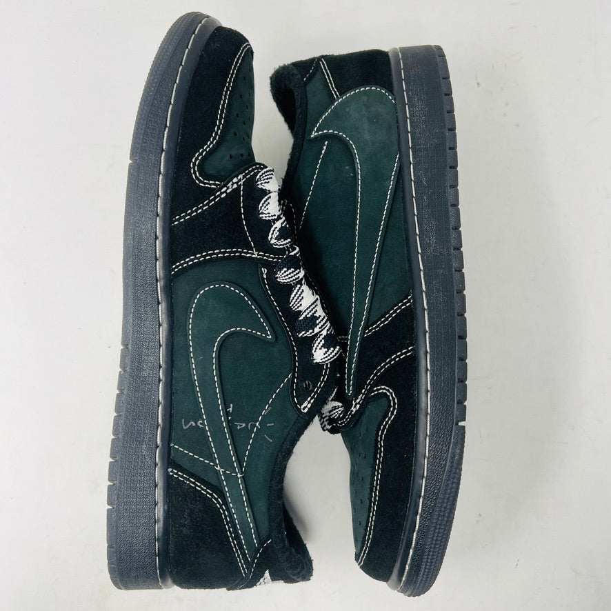 A pair of Jordan 1 Retro Low OG SP Travis Scott Black Phantom sneakers with perforated toe boxes and black and white checkered laces includes extra laces for added style. These authentic Jordans are displayed side by side on a white surface.