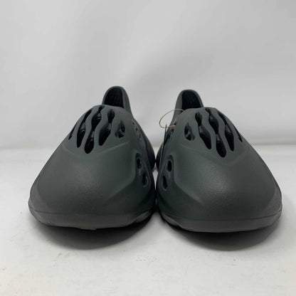 Yeezy Foam Runner Carbon shoes in sleek carbon colorway, offering comfort and lightweight design.