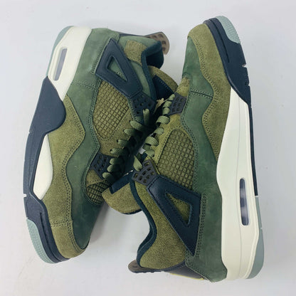 The Jordan 4 Retro SE Craft Medium Olive sneakers feature a blend of green, black, and white with a mesh and suede texture. Elegantly presented on a green shoebox against a white backdrop, they epitomize 100% authentic craftsmanship by Jordan.
