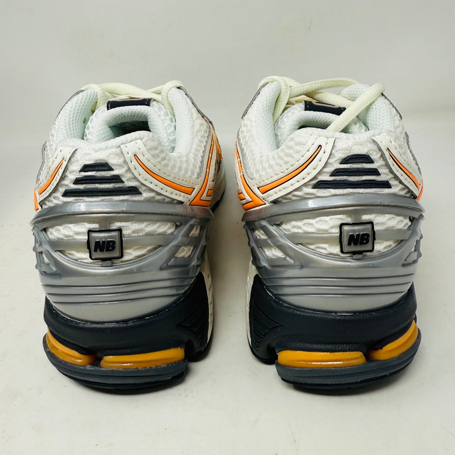 New Balance 1906R ASOS Exclusive Neon Pack in orange on display box.
